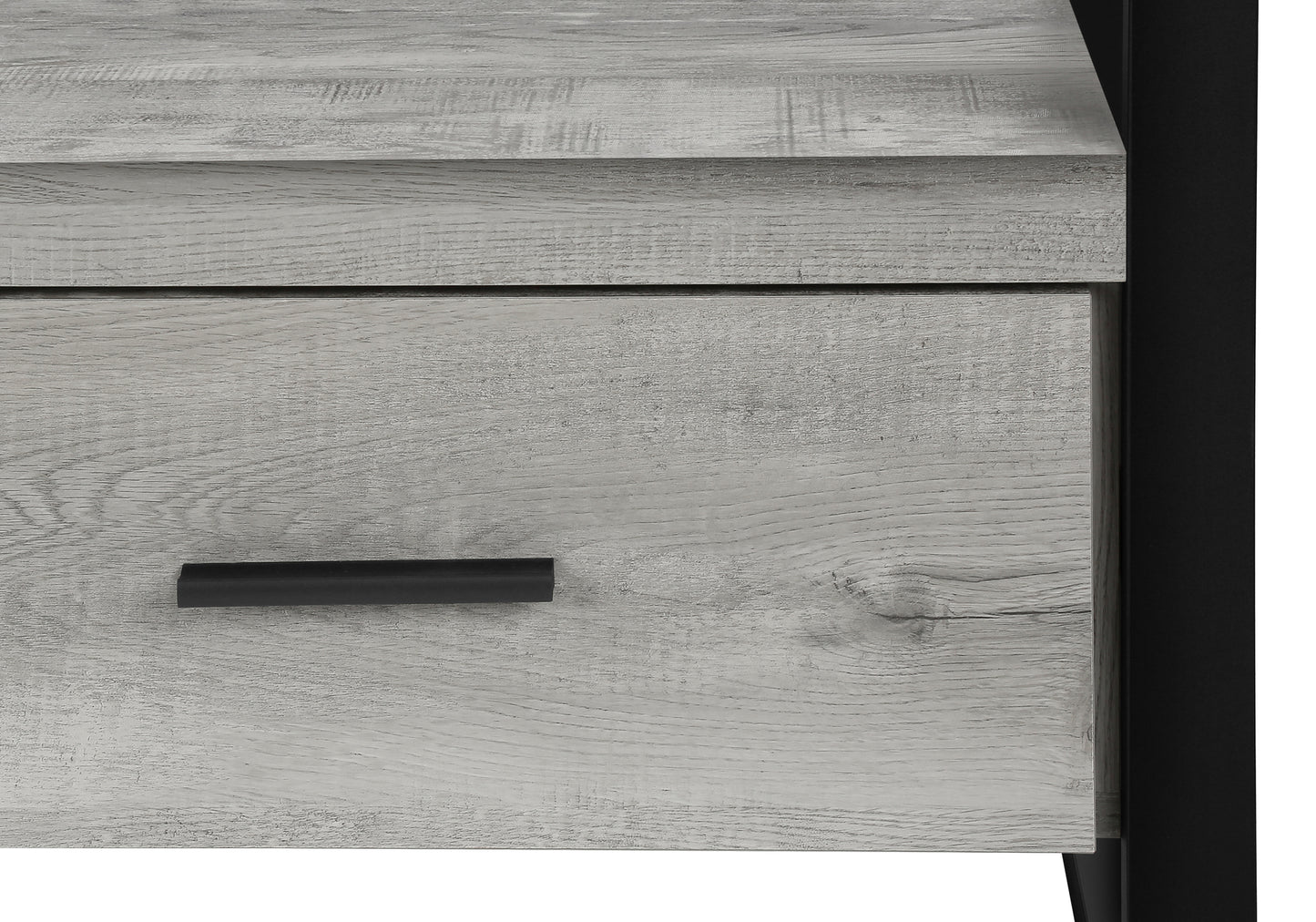 Rustic grey wood grain texture on a drawer front with a black handle