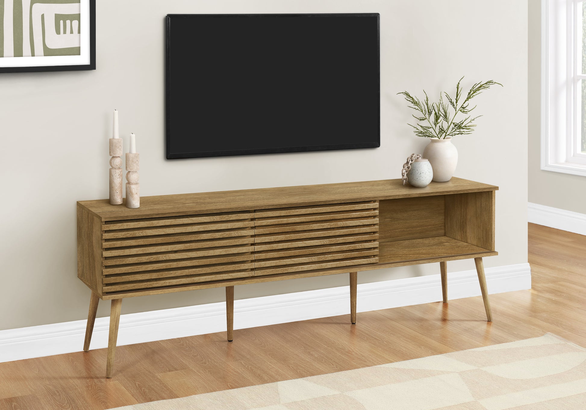 Midcentury modern oak media console with slatted drawer fronts and tapered legs
