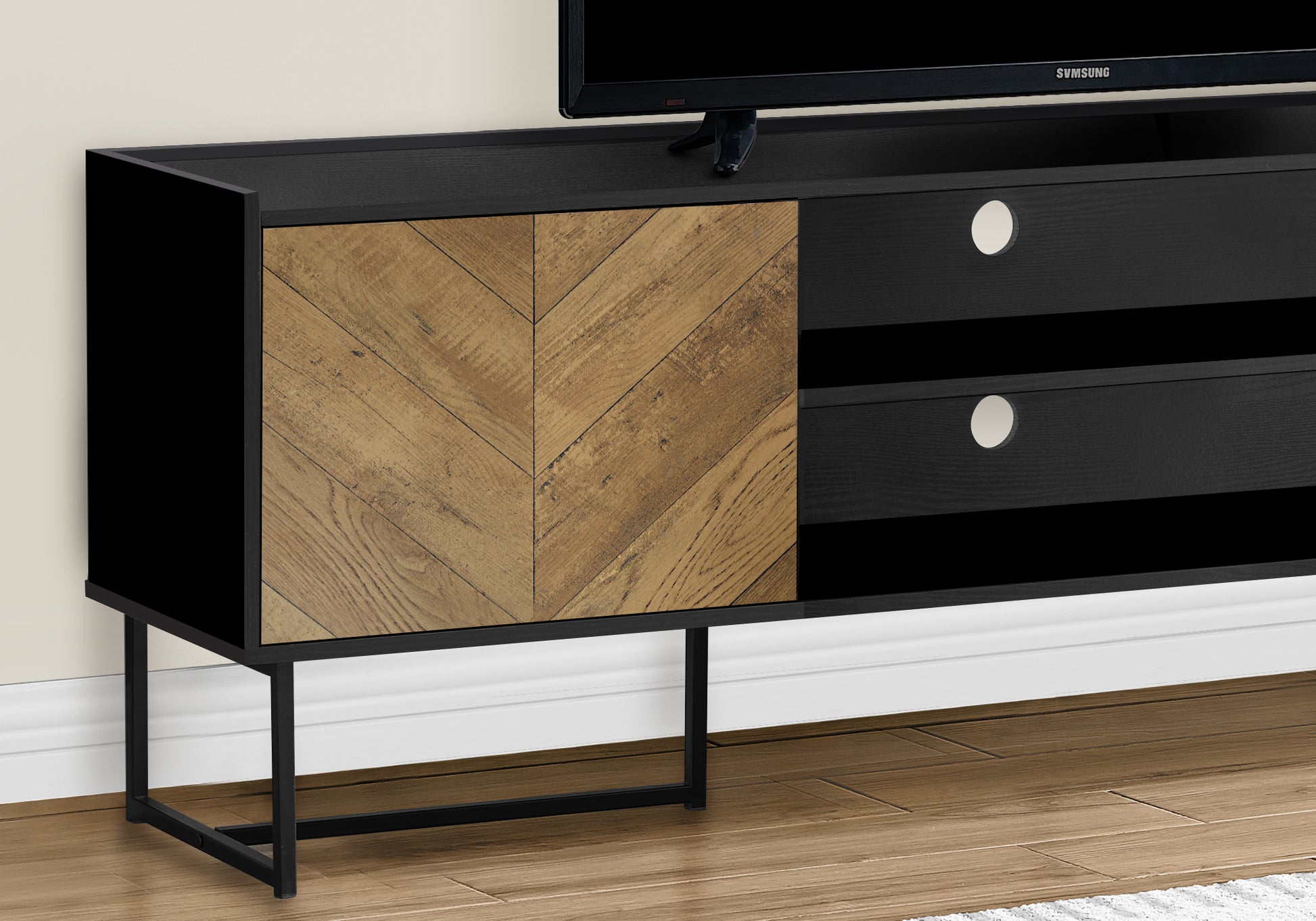 Black media console with rustic wood chevron door and metal legs