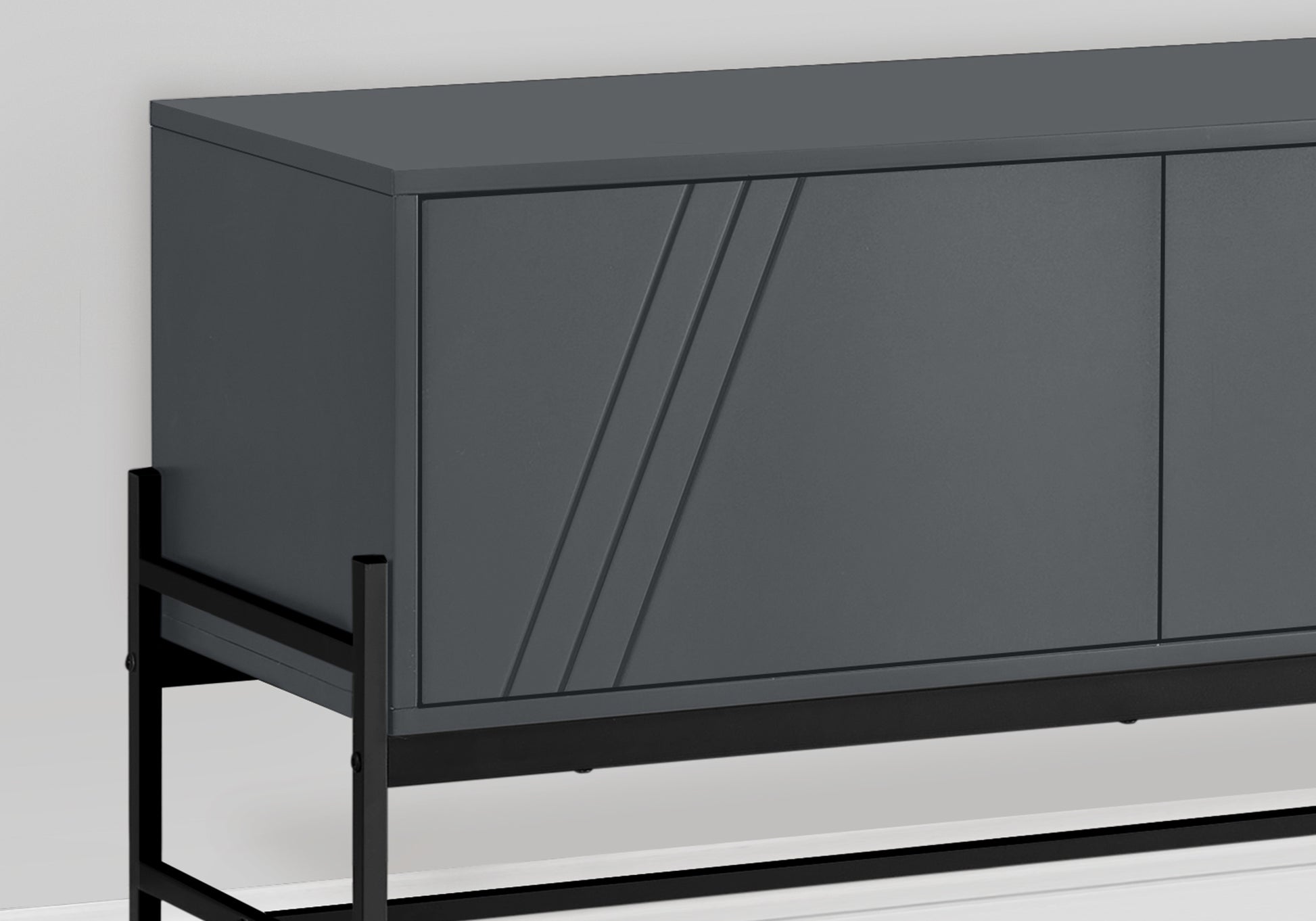 Modern dark gray sideboard with subtle etched diagonal lines on one door on black metal legs