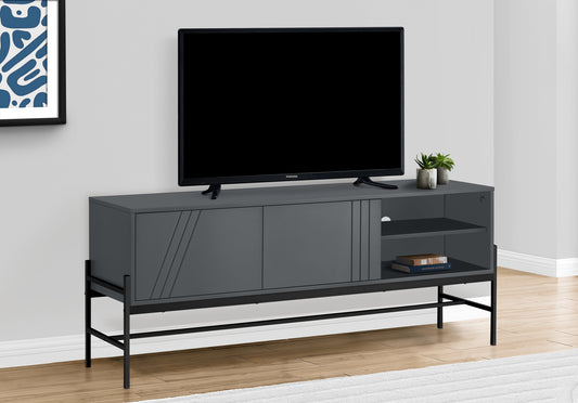 Modern gray TV stand with black metal legs and decorative grooved doors featuring open shelving