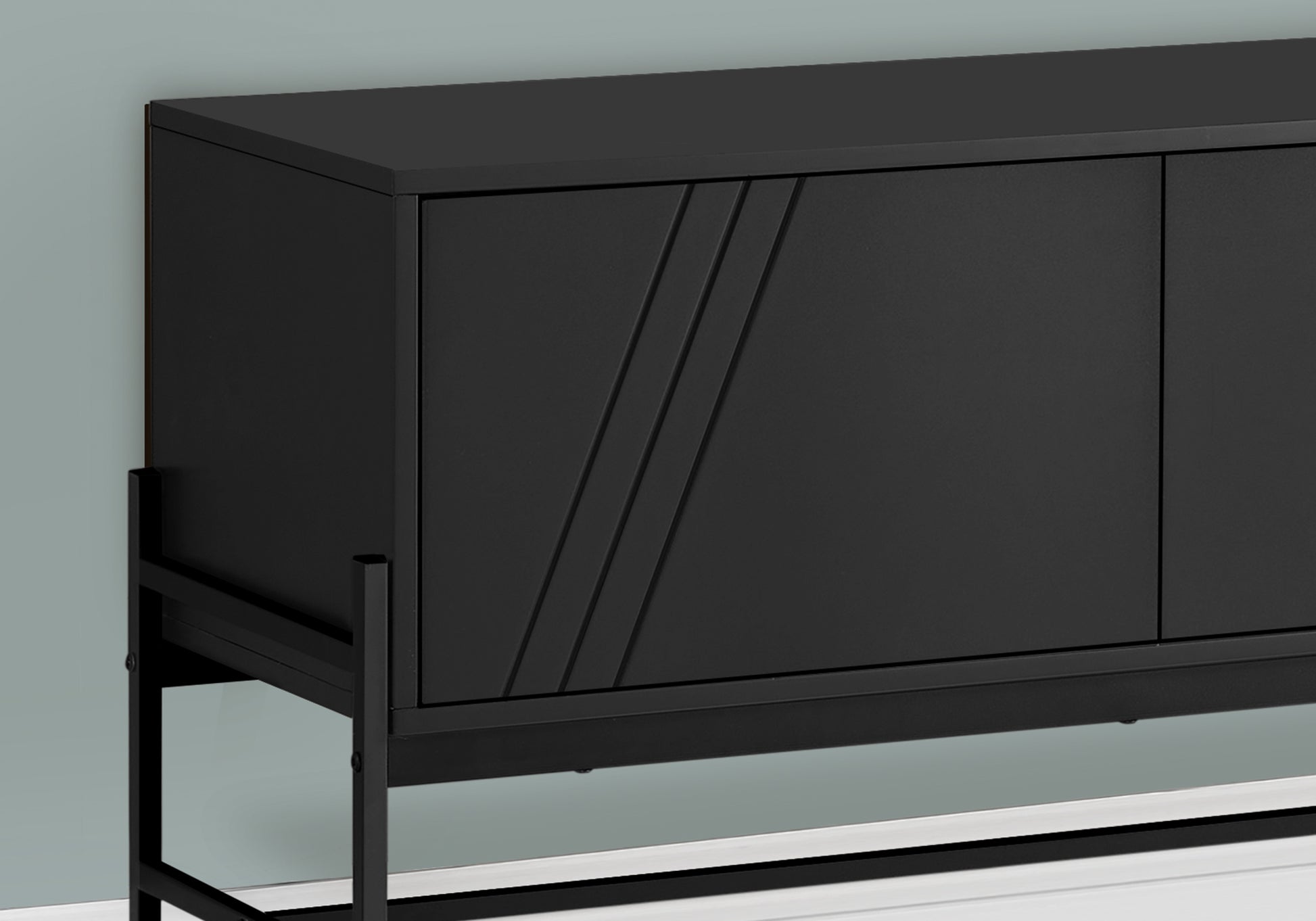 Black modern sideboard with textured door panels and slim metal legs