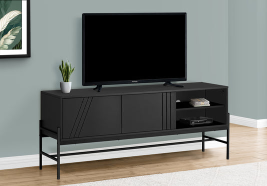Modern black TV stand with slatted door detail and metal legs