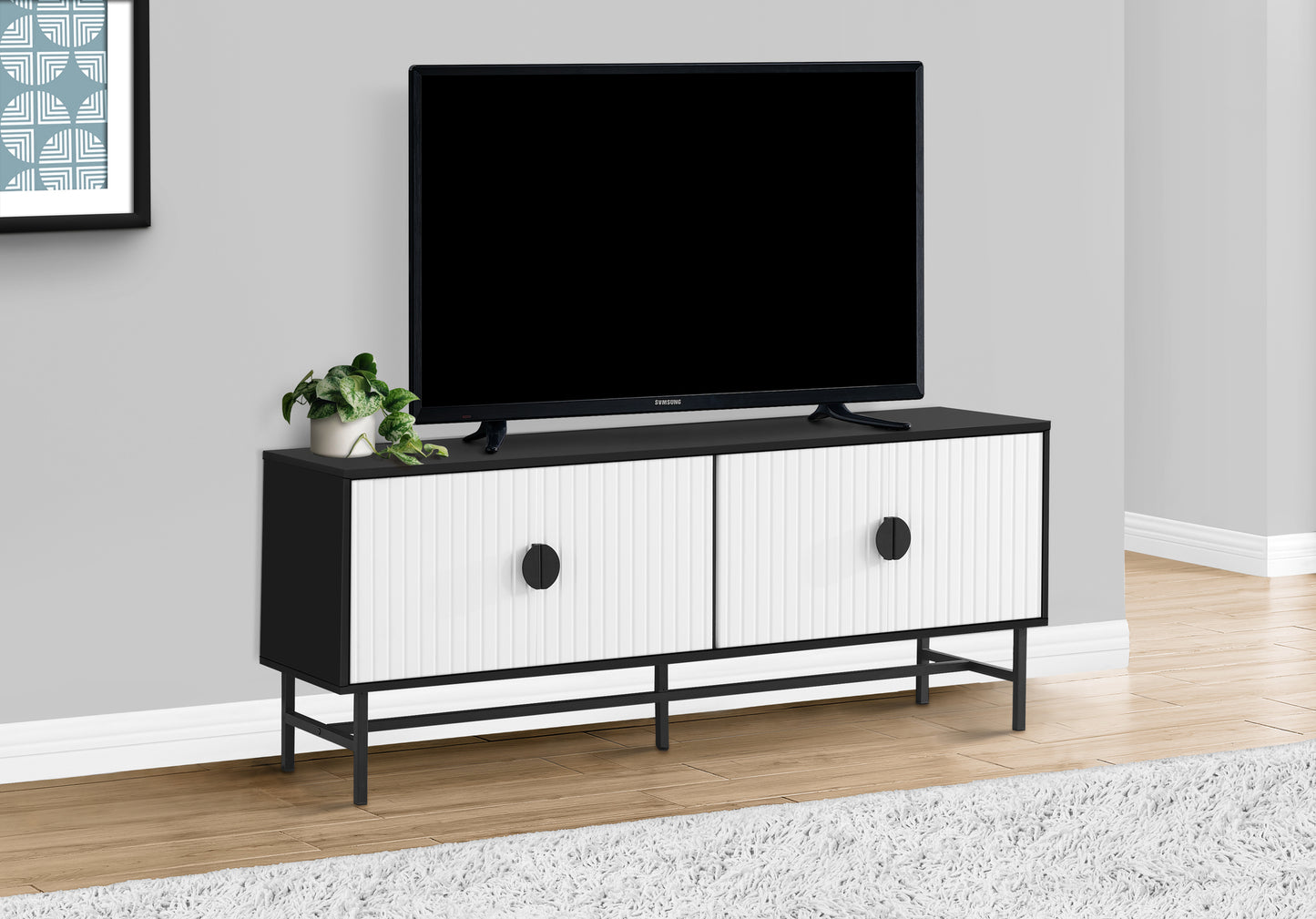 Modern black and white media console with ribbed doors perfect for a living room