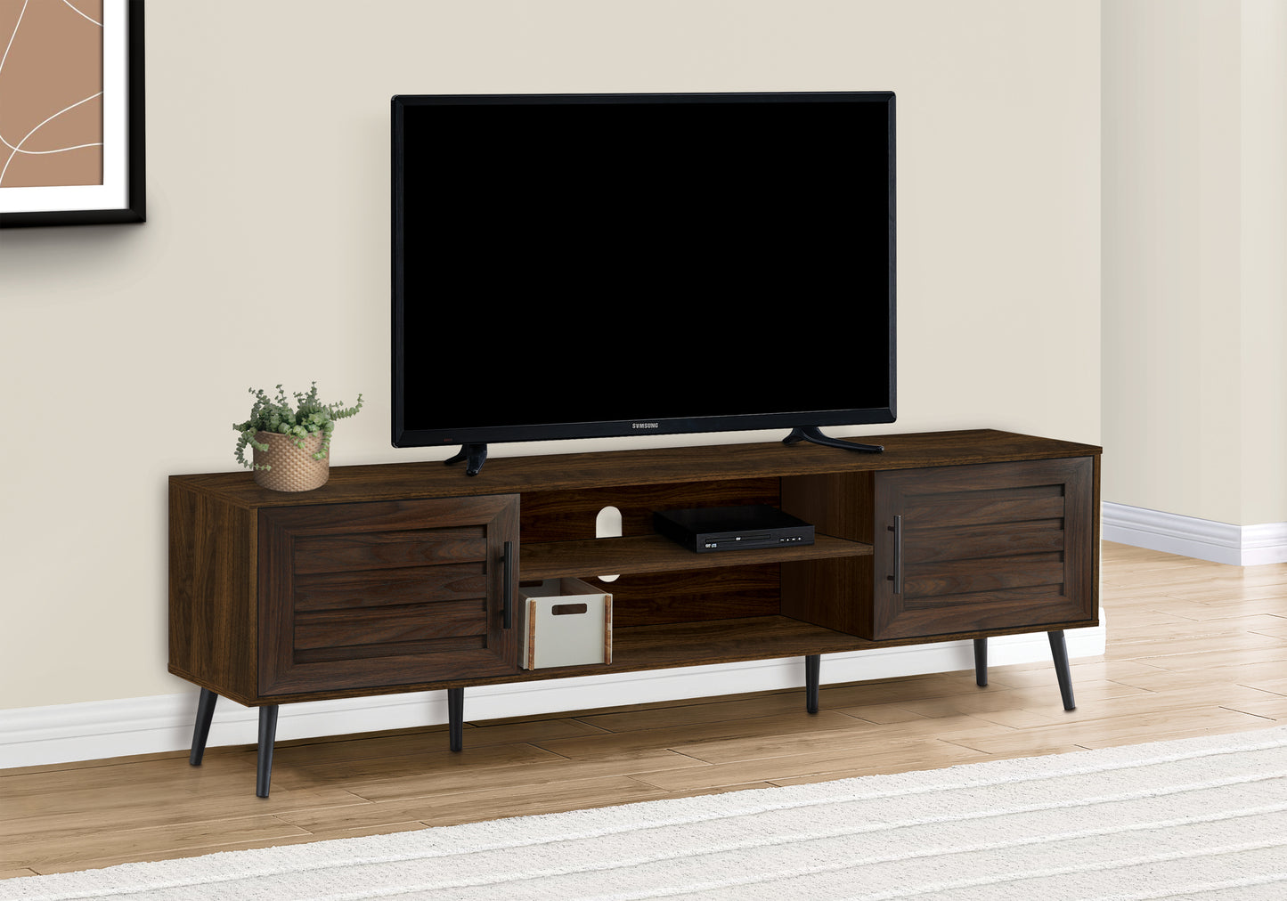 Dark wood TV stand with slatted cabinet doors and midcentury modern tapered legs