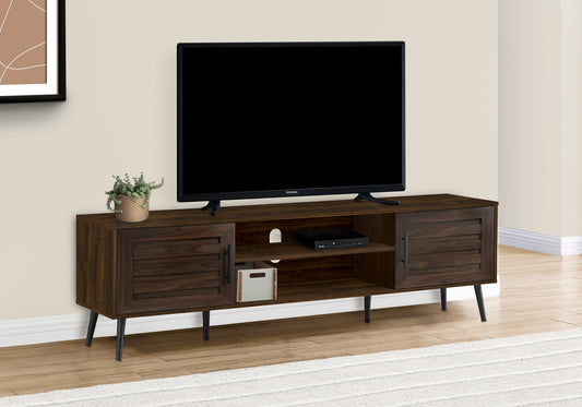 Dark wood TV stand with slatted cabinet doors and midcentury modern tapered legs