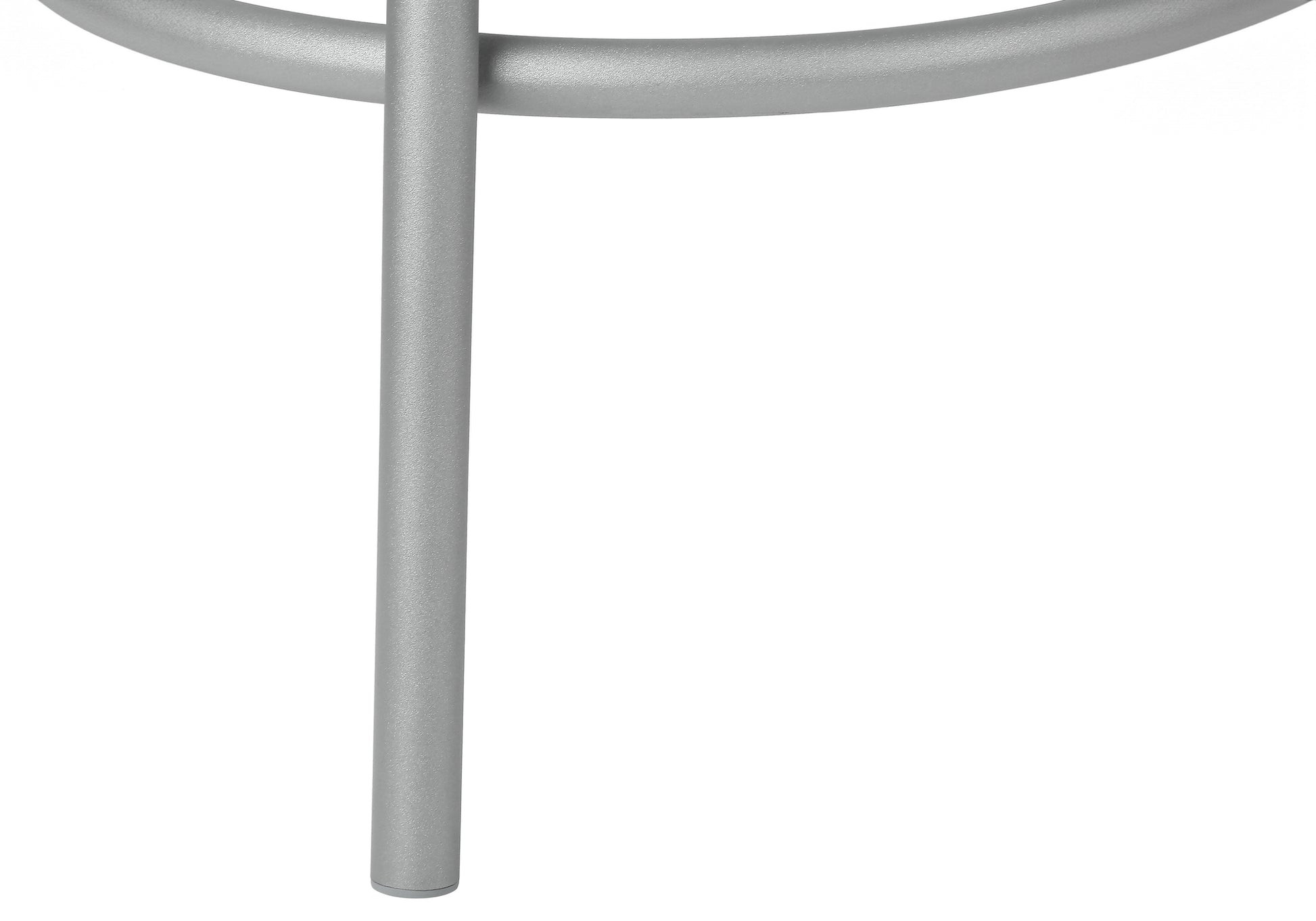 Close up of sleek silver metal desk legs for a modern office setup