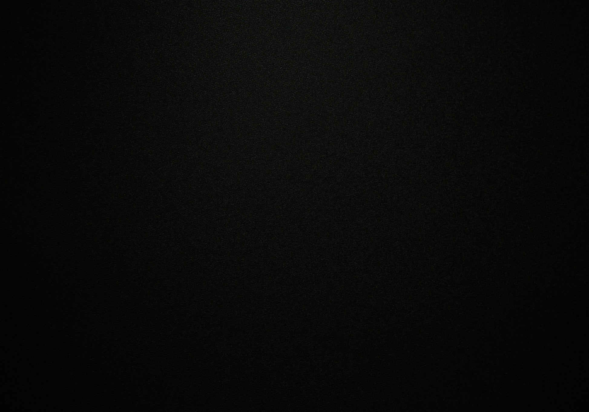 Solid black textured background for product display creating a sleek and modern aesthetic