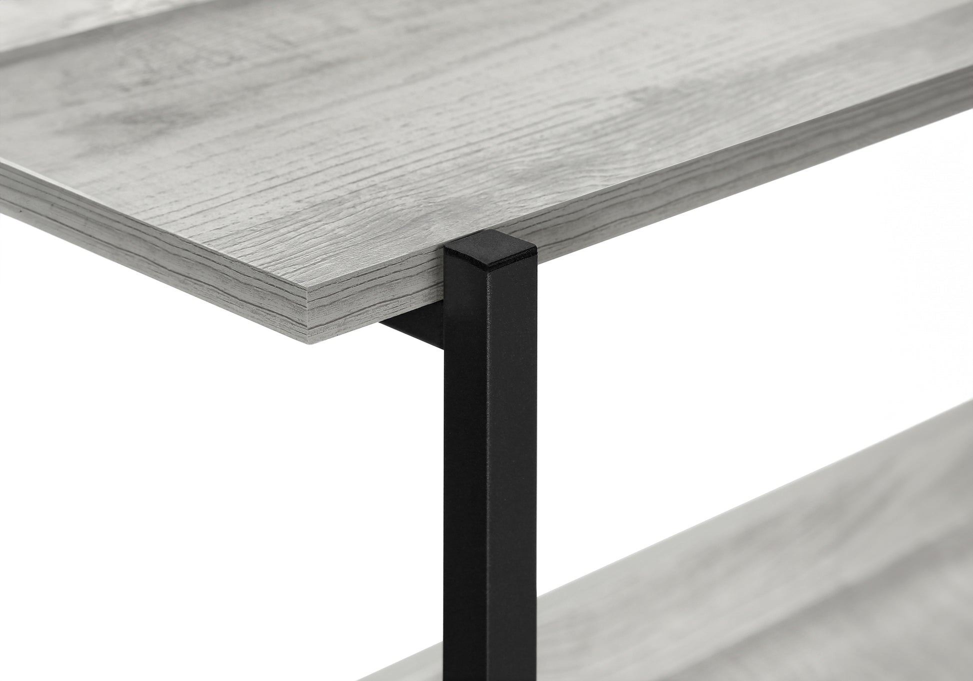 Closeup of a rustic grey wood shelf with black metal support leg