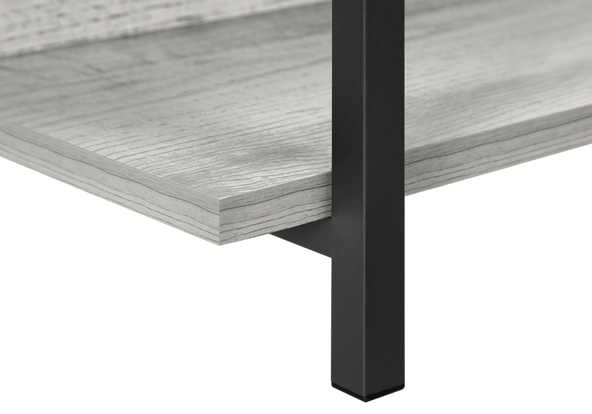 Closeup of a gray wood grain shelf with black metal legs part of a modern furniture piece