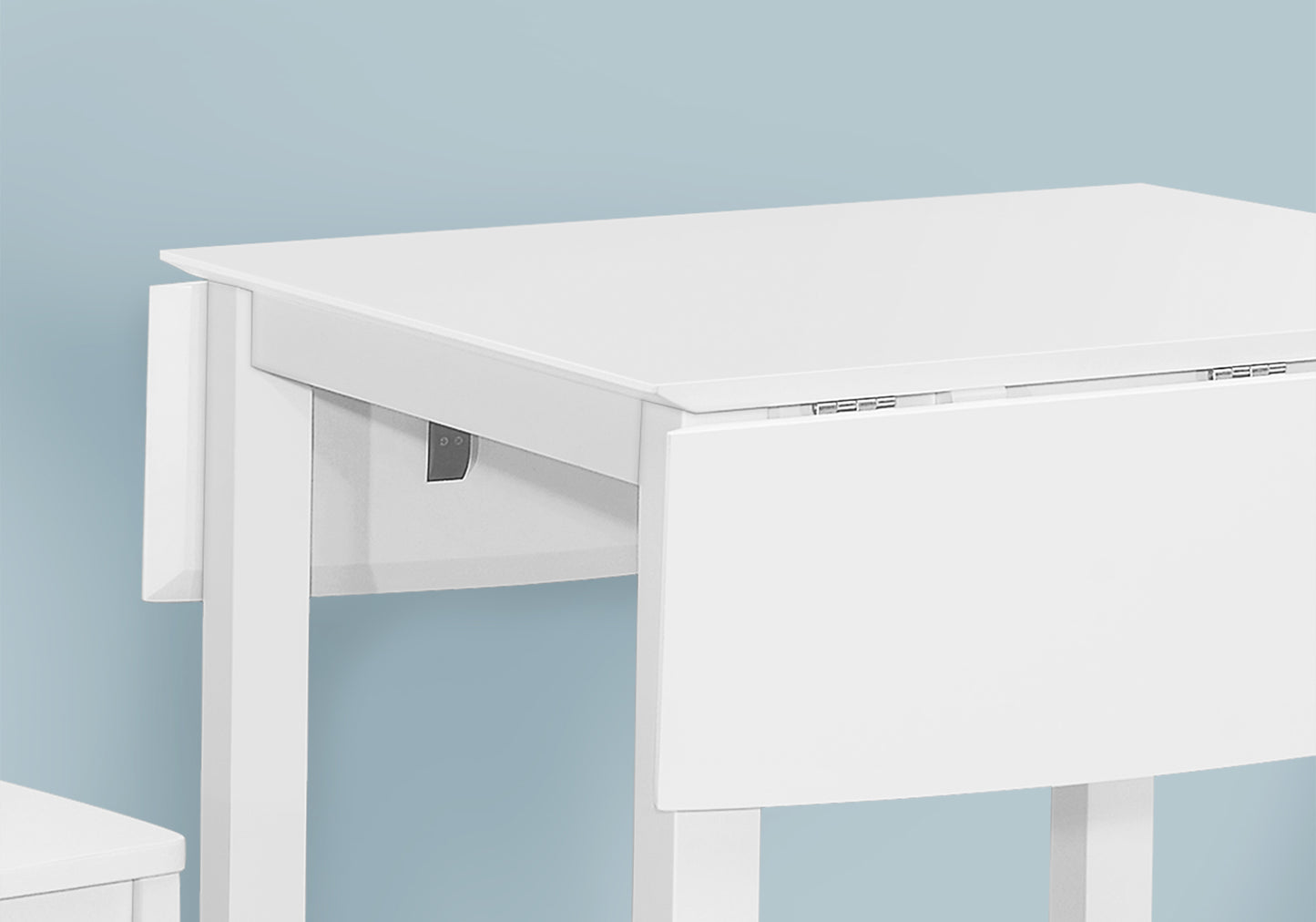 White drop leaf table with wooden legs ideal for small spaces
