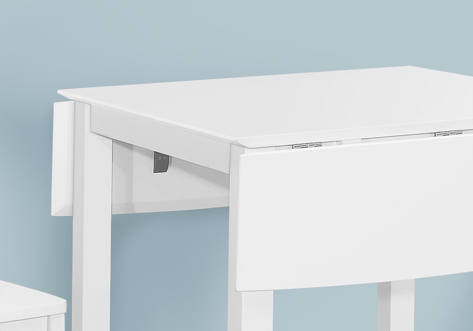 White drop leaf table with wooden legs ideal for small spaces