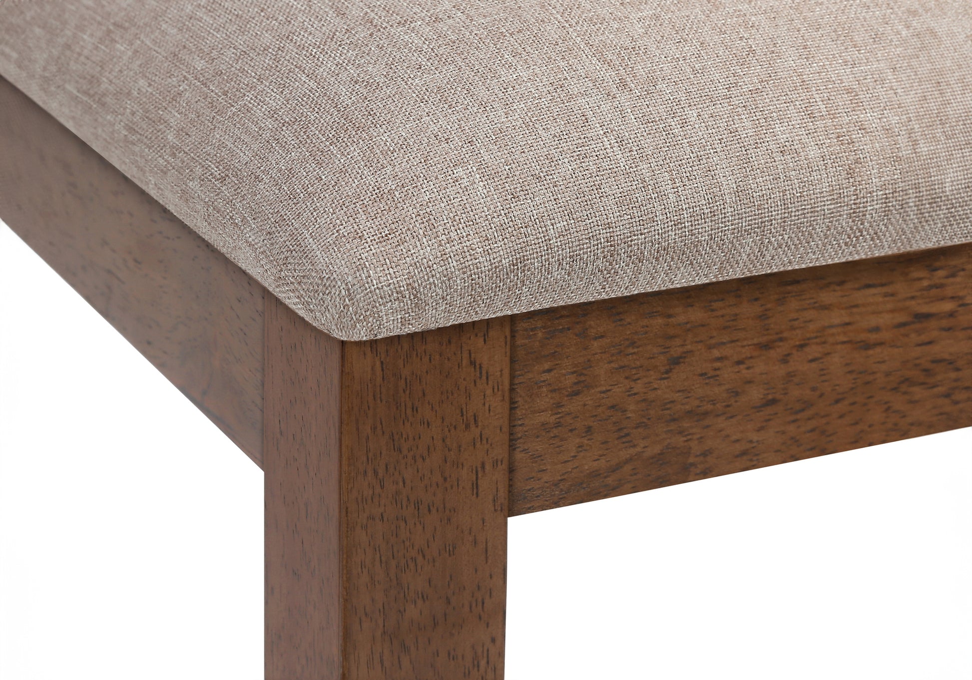 Upholstered dining chair seat with a textured beige fabric and solid walnut wood legs