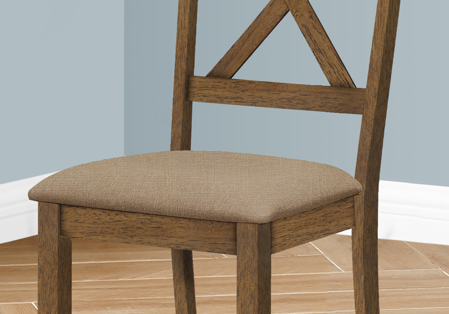 Rustic wooden dining chair with a textured beige upholstered seat and Xback detail