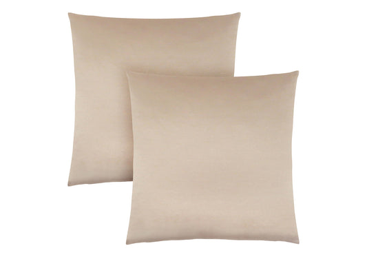 Two light beige velvet throw pillows on a white background elegant home decor
