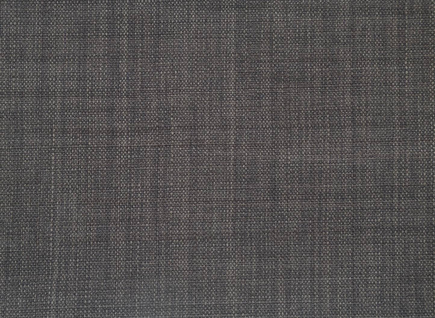 Closeup of dark charcoal woven fabric swatch ideal for upholstery