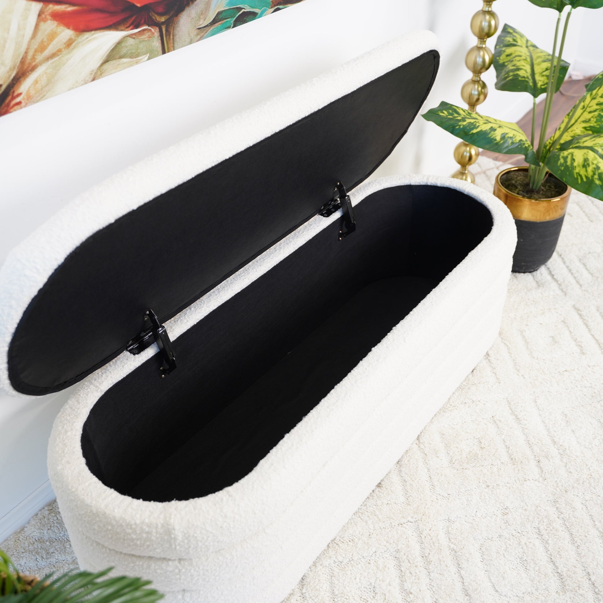 Plush white storage bench with open lid showing black interior  characters