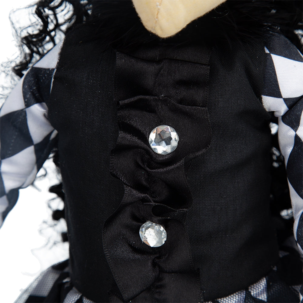 Black doll with diamond buttons and harlequin sleeves
