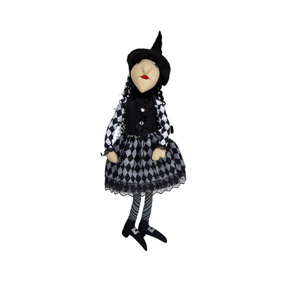 Black and white harlequin pattern doll with a witch hat and red lips