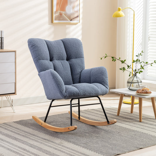 Plush grey rocking chair with tufted back wooden rockers and black metal frame ideal for nursery