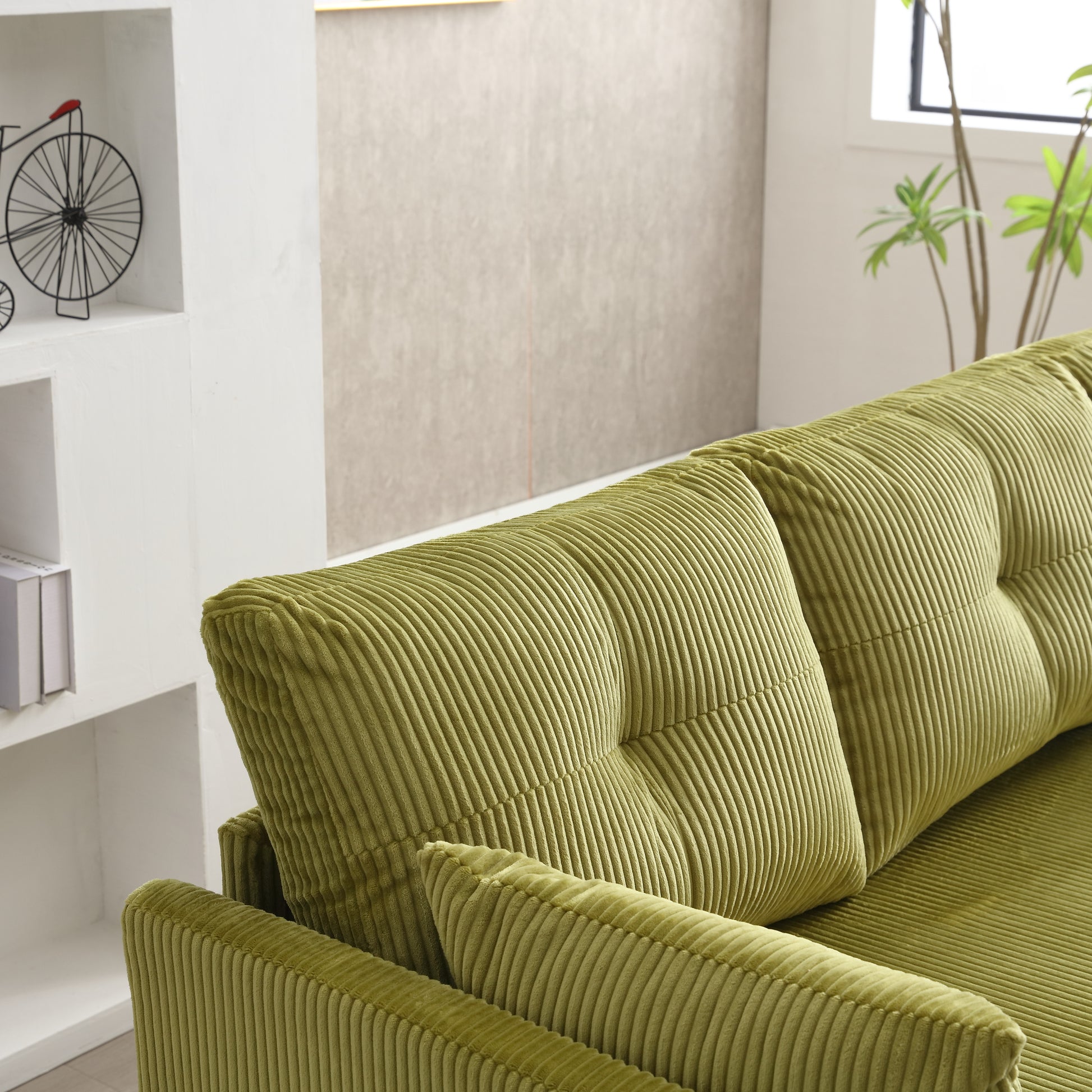 Plush lime green corduroy sofa with tufted cushions ideal for a cozy living room