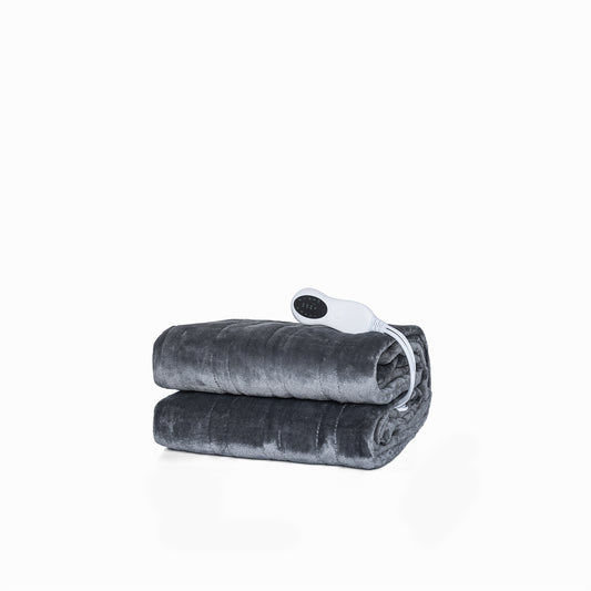 Dark grey plush heated blanket with controller folded on white background