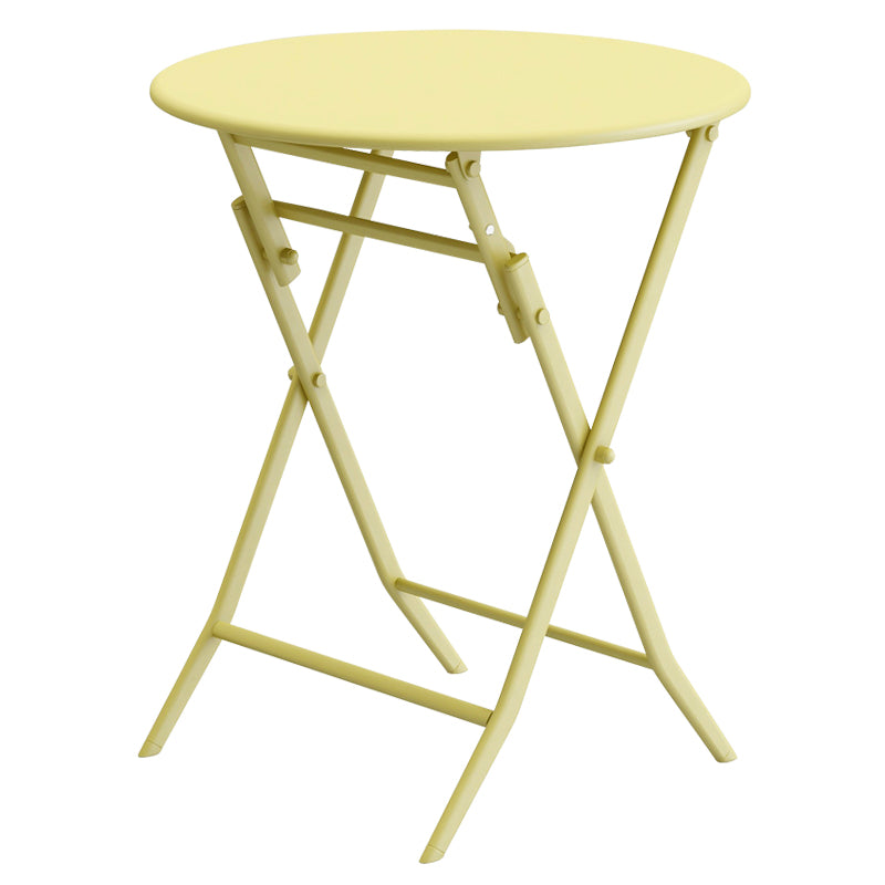 Pastel yellow metal folding bistro table with Xshaped legs