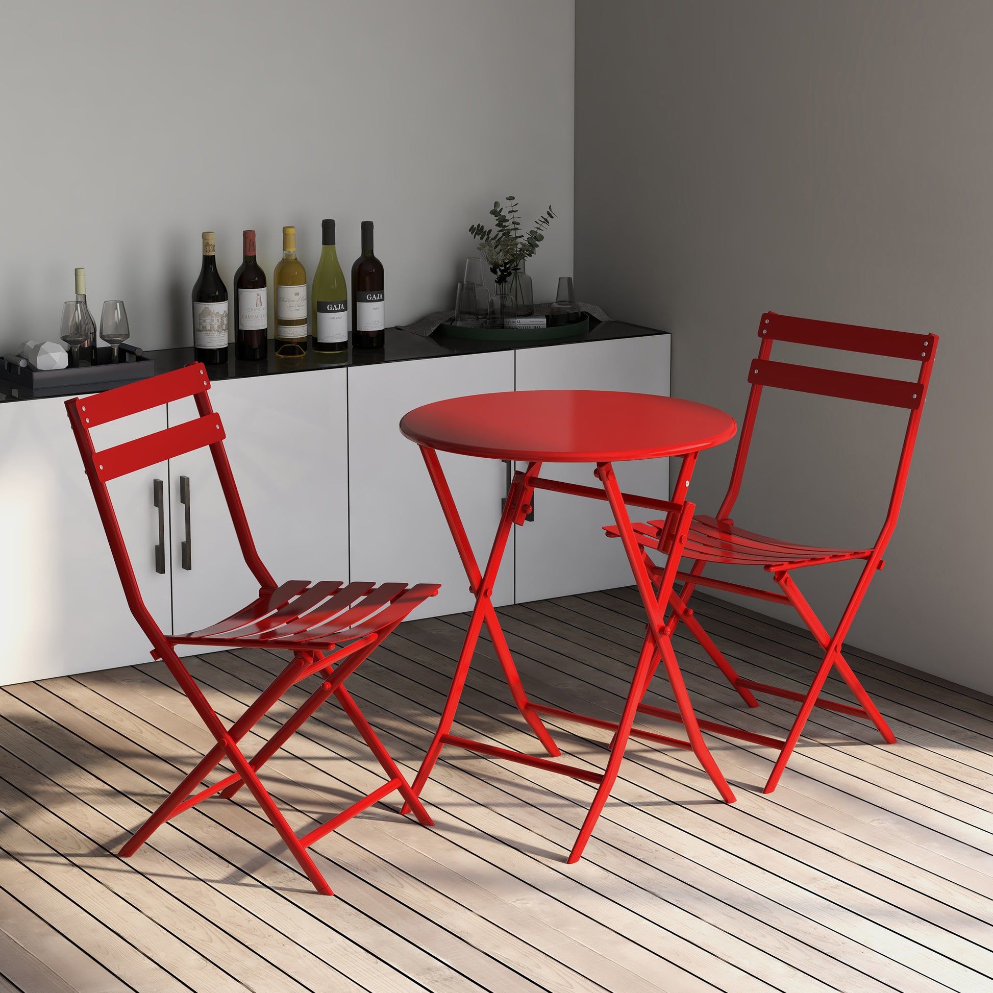 Red metal bistro set with folding chairs and round table
