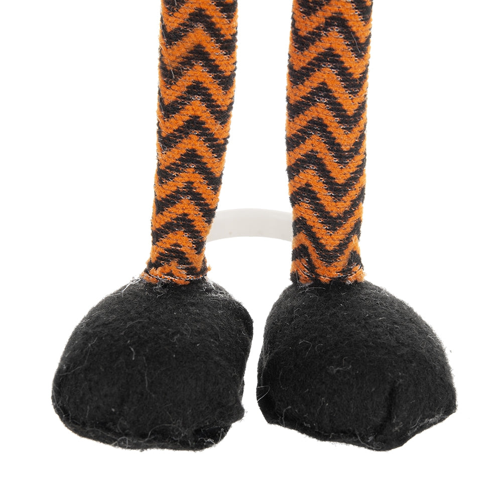 Plush doll legs with orange and black chevron pattern fabric and black felt feet