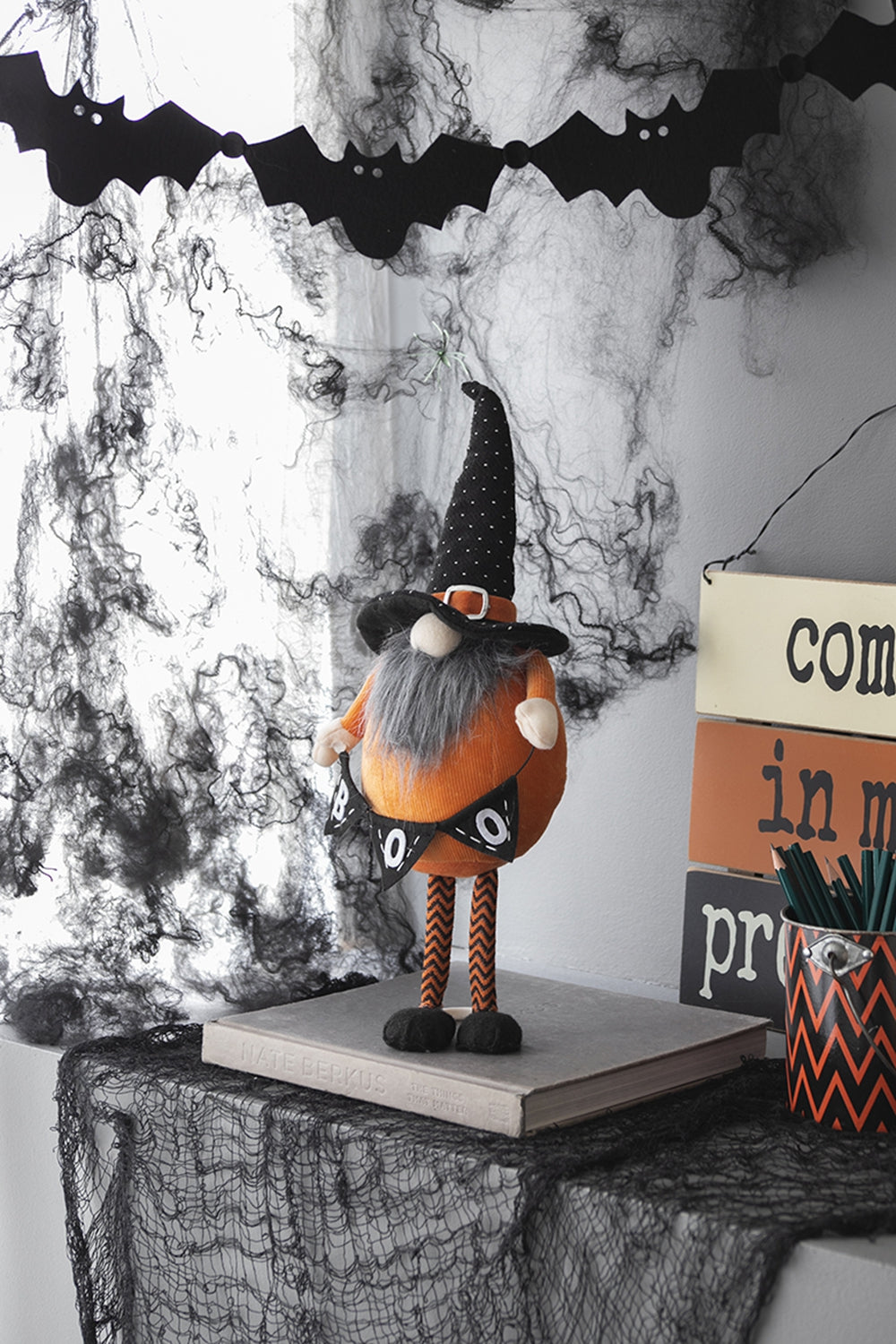 Orange Halloween gnome with black polka dot hat and BOO banner