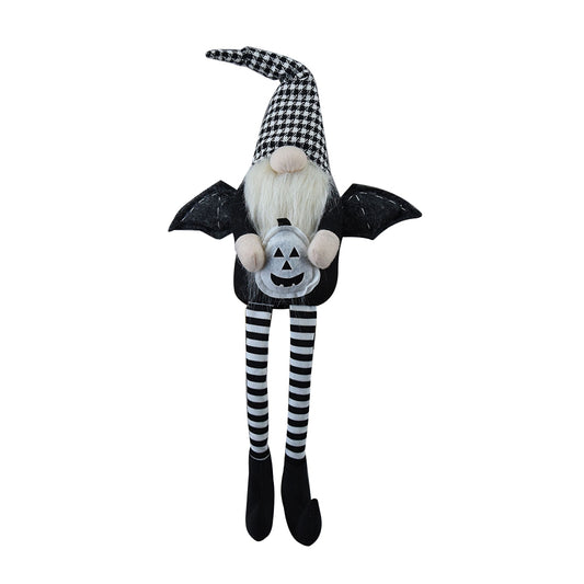 Halloween gnome with black and white checkered hat and striped legs holding pumpkin