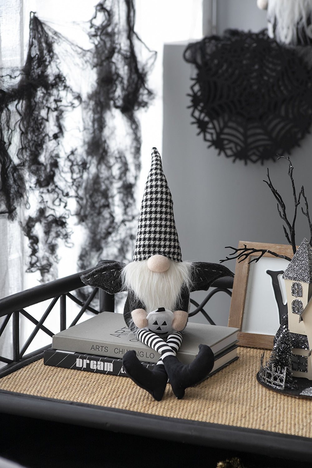 Halloween gnome with black and white checkered hat and pumpkin detail