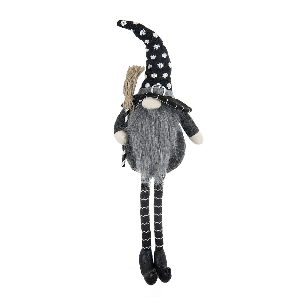 Black and white polka dot witch gnome with broom and striped legs perfect for Halloween decor