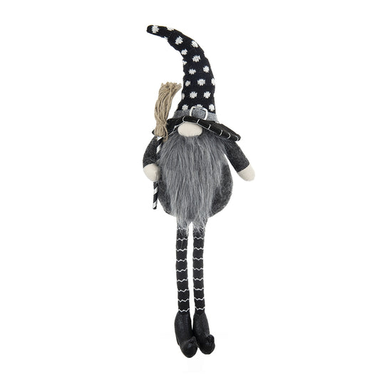 Black and white polka dot witch gnome with broom and striped legs perfect for Halloween decor