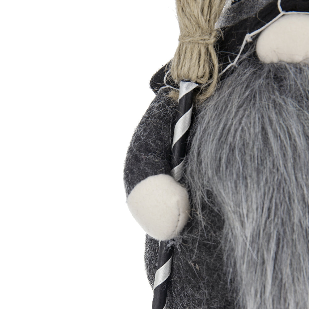 Grey felt gnome with long grey beard holding a broomstick staff