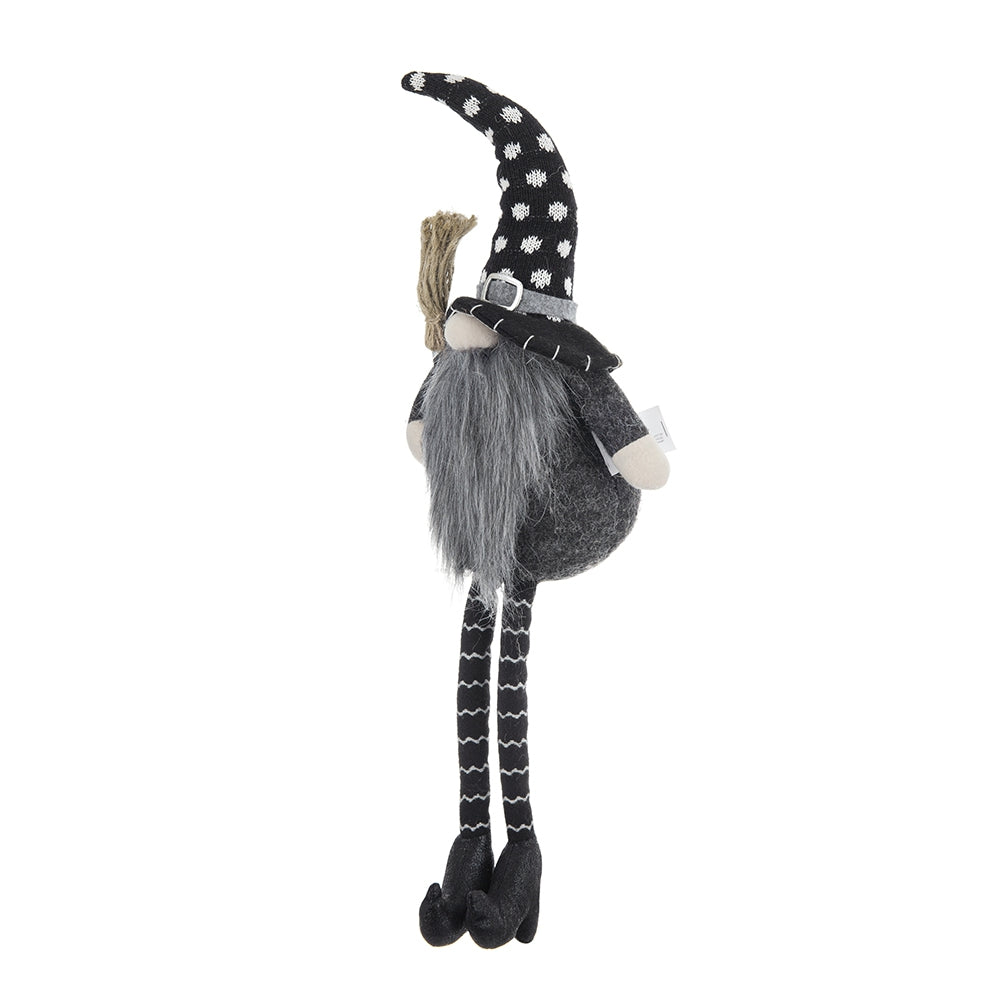 Black and white polka dot witch gnome with long grey beard and broom