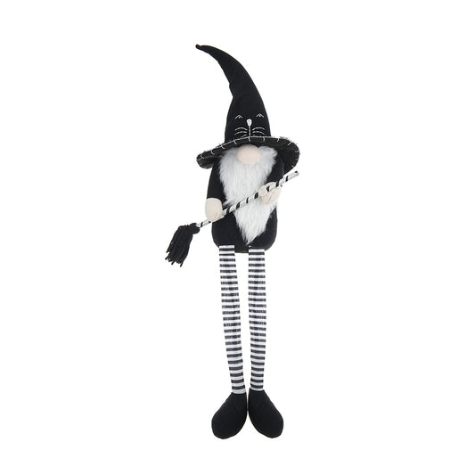 Black and white witch gnome with broom festive holiday decor