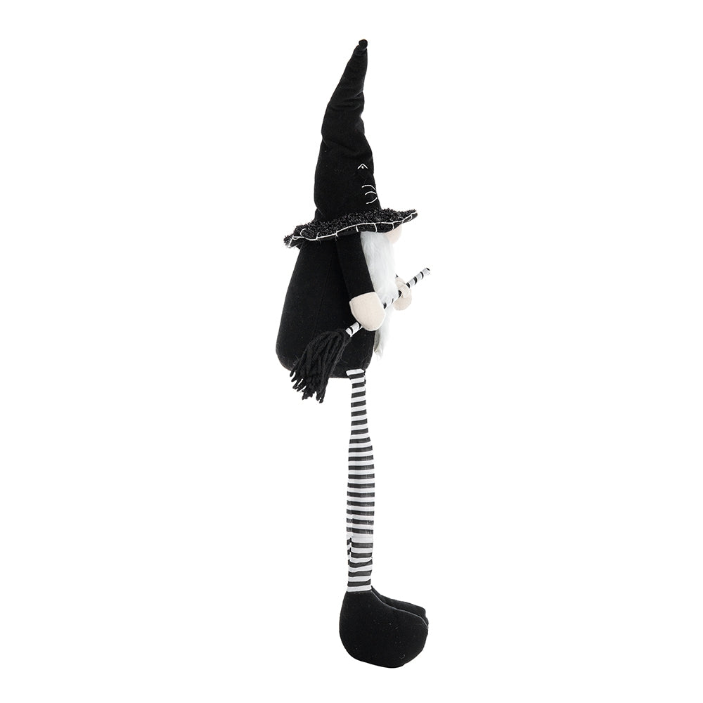 Black witch gnome with long striped legs and broom decoration