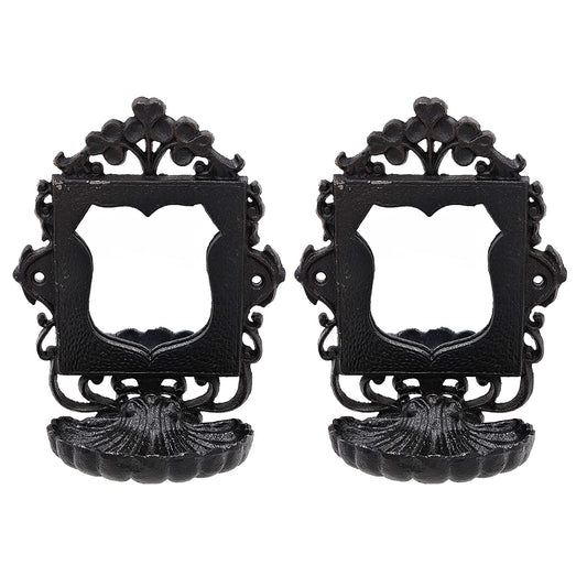 Pair of black ornate cast iron wall hooks with shell base antique style