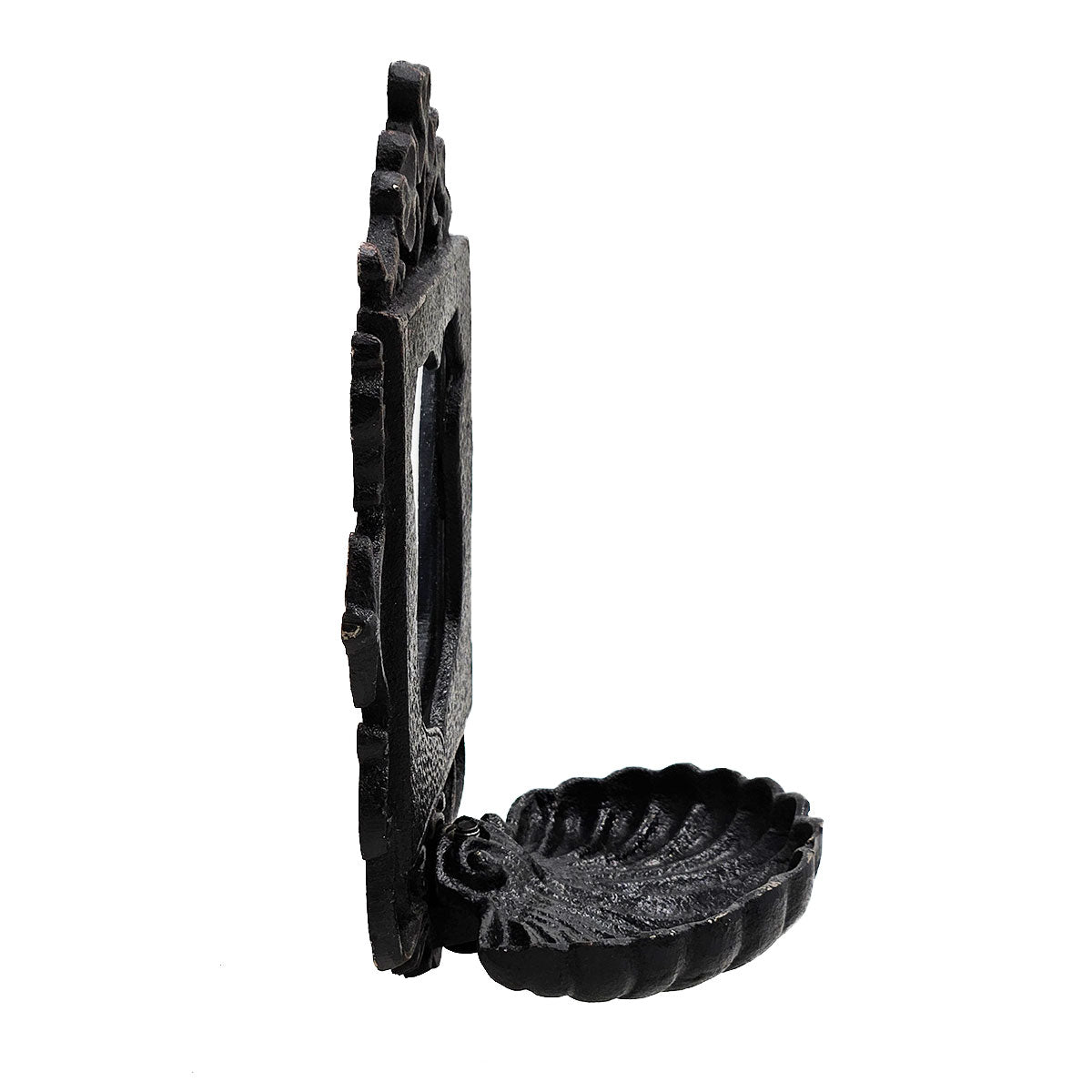 Ornate black cast iron wallmounted soap dish with a decorative frame and seashell basin