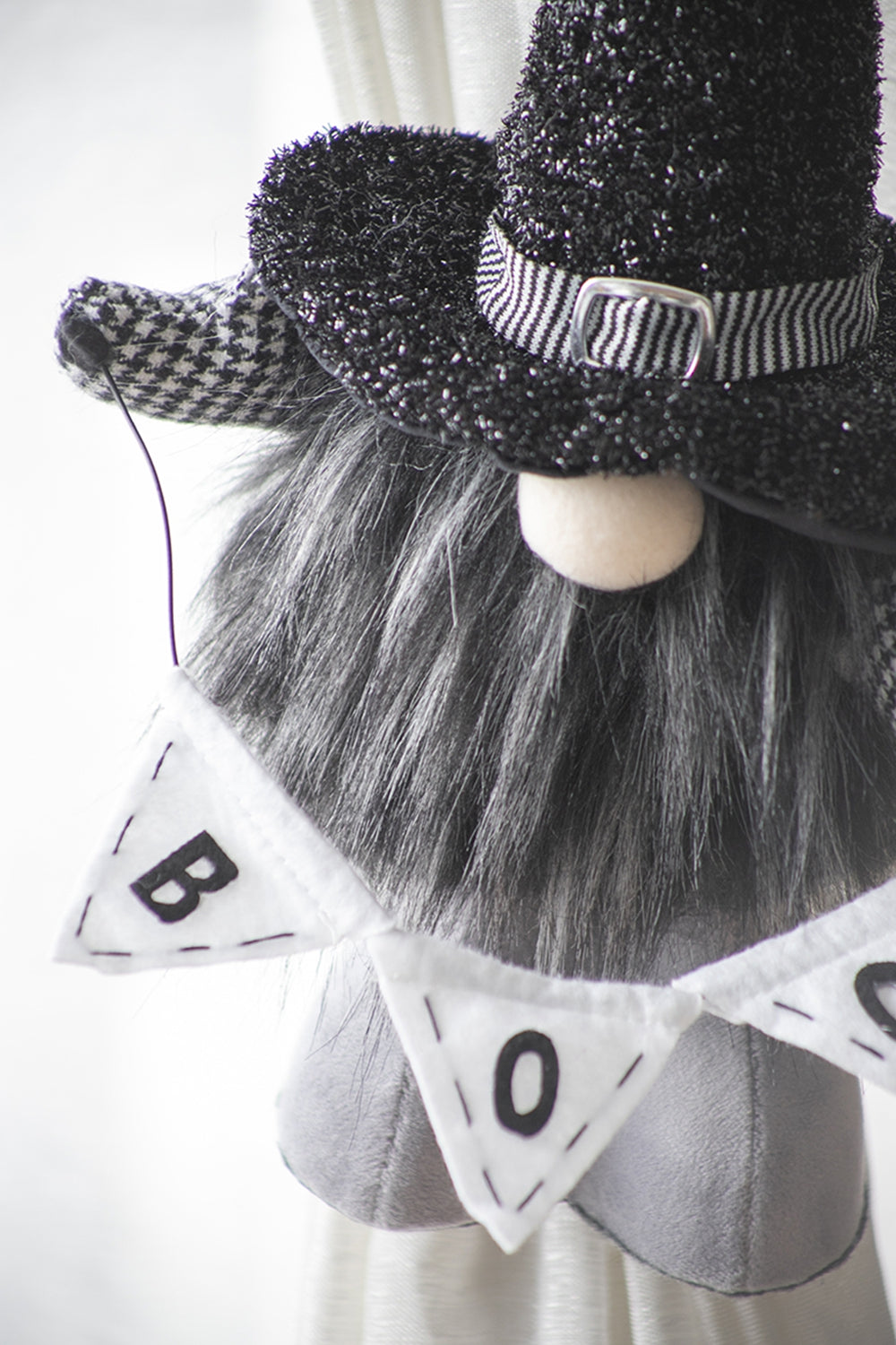 Black glitter witch hat gnome with houndstooth brim and BOO banner for Halloween decor
