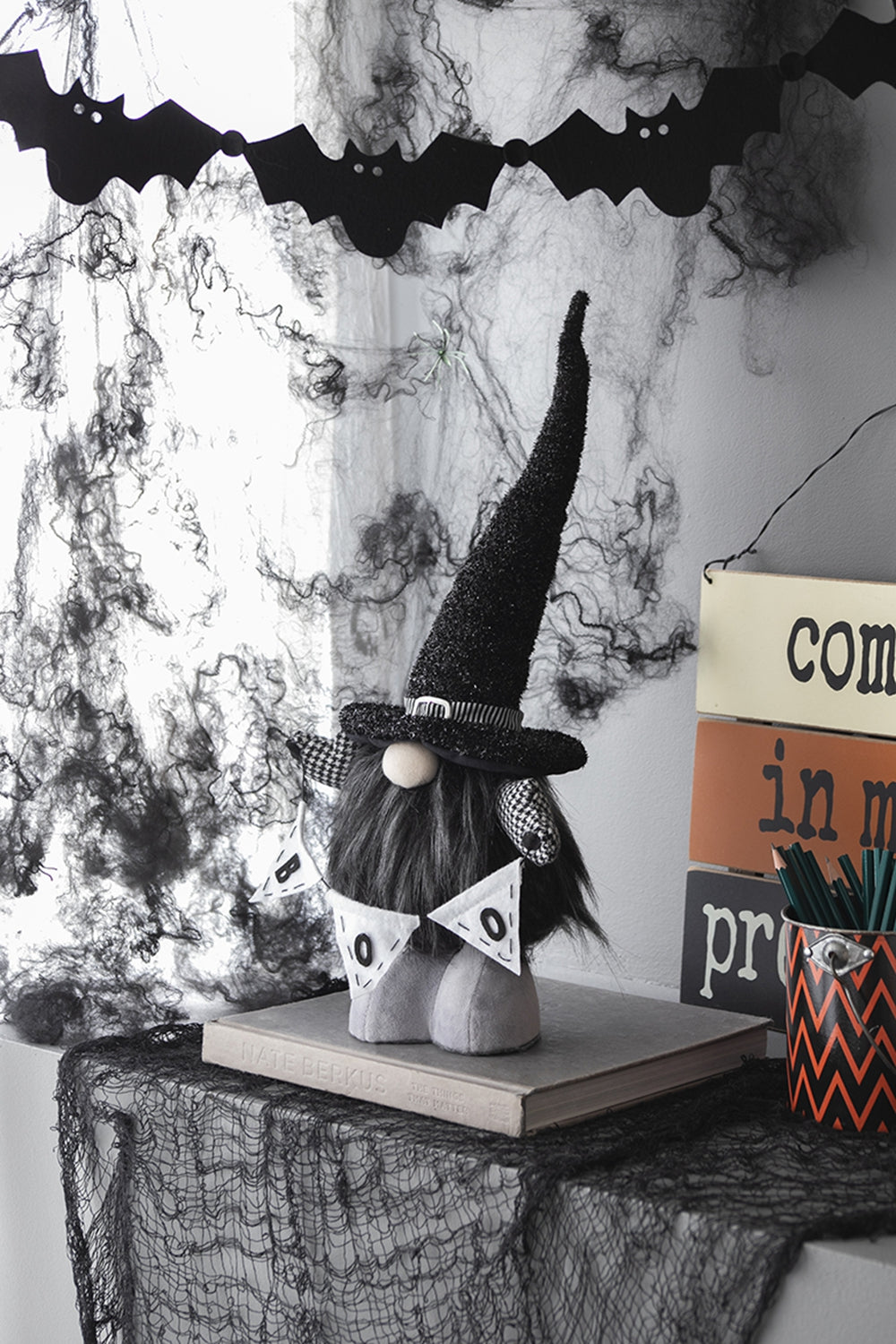 Spooky Halloween gnome with witch hat and BOO banner perfect for holiday decor