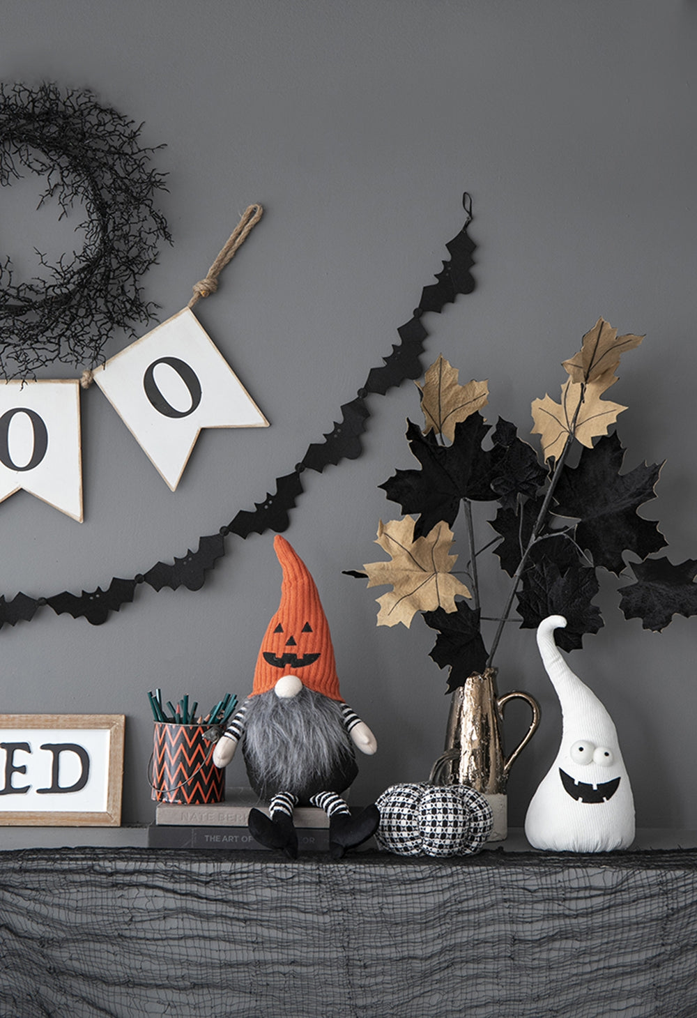 Orange knitted Halloween gnome with pumpkin hat and gray beard