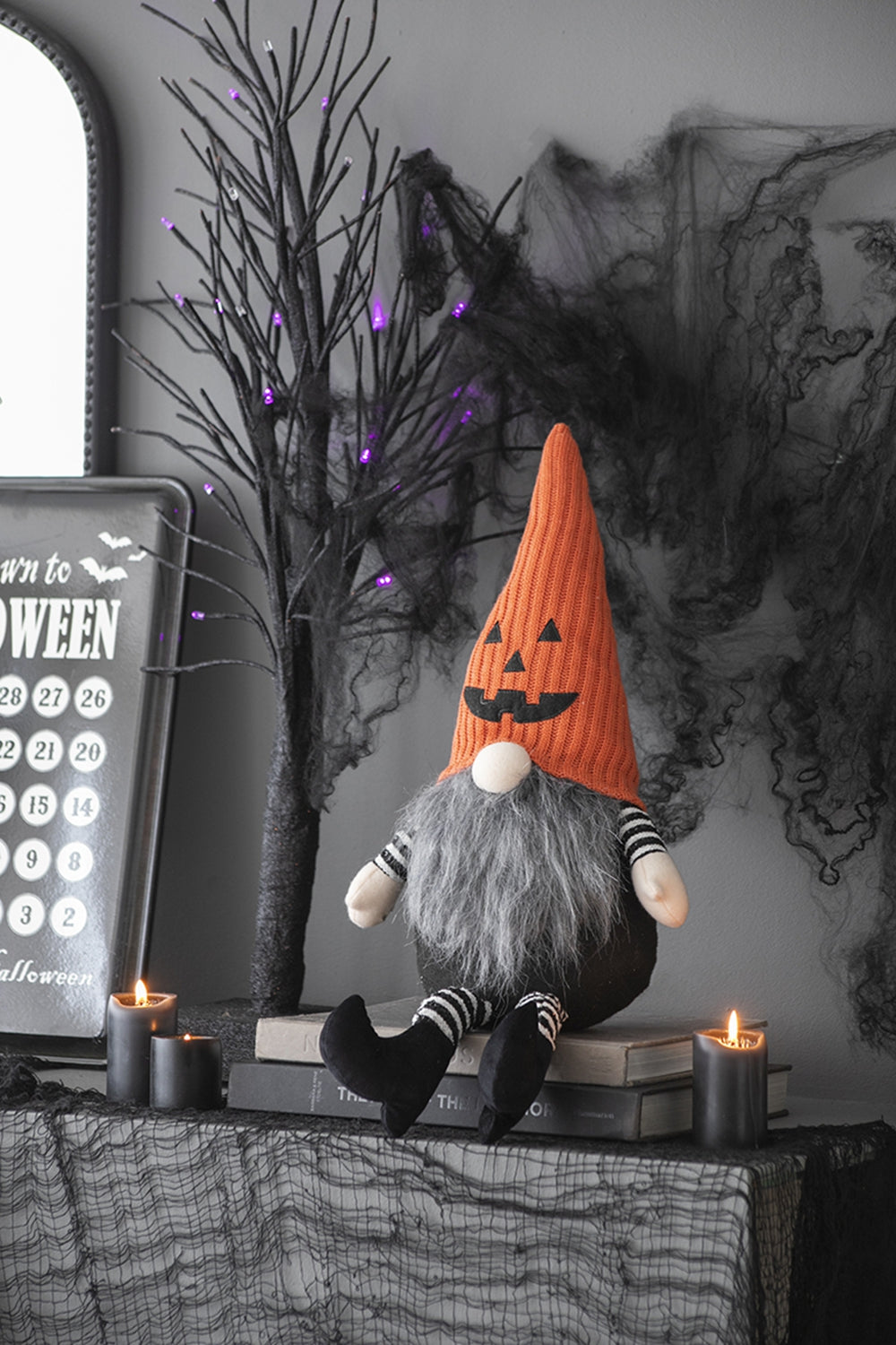 Halloween plush gnome with orange pumpkin hat grey beard and striped socks