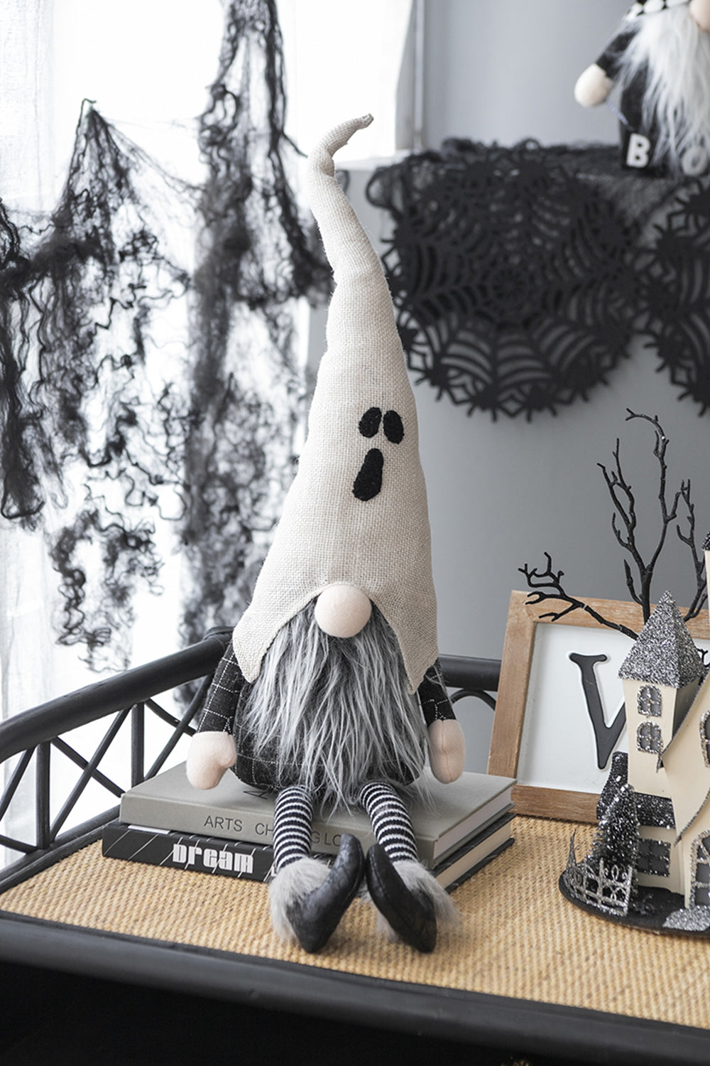 Light grey fabric ghost gnome with long beard and striped socks perfect for Halloween decor