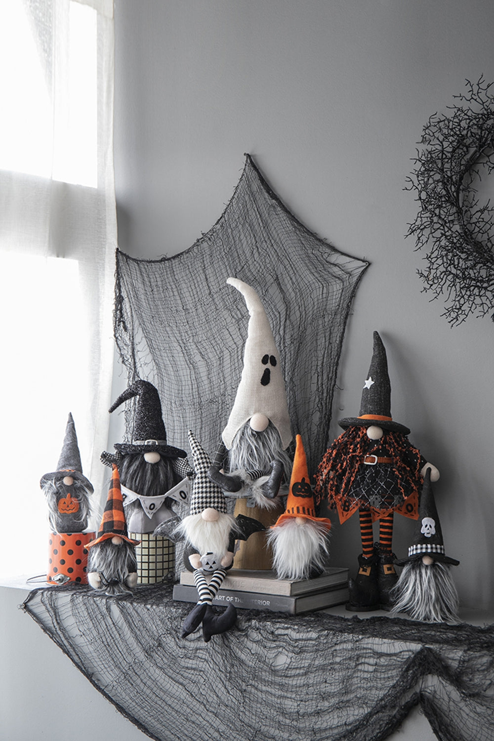 Group of seven Halloween gnomes with pointed hats festive attire and plush designs