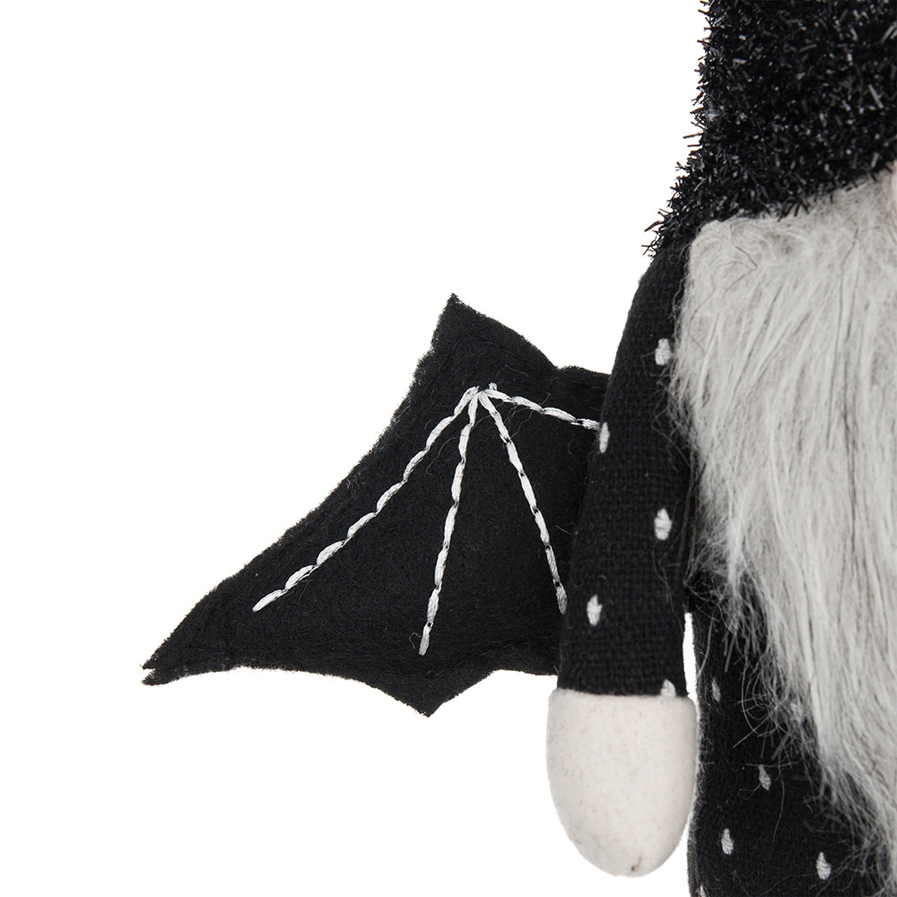 Felt bat wing accent on a black polka dot gnome perfect for Halloween decor