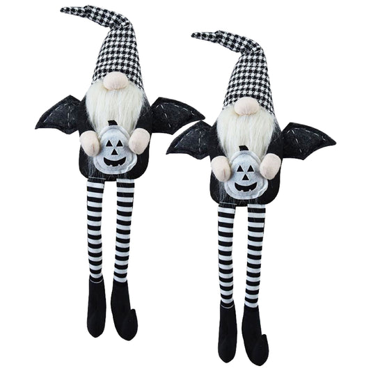 Two Halloween gnomes with bat wings and pumpkin decorations ideal for holiday decor