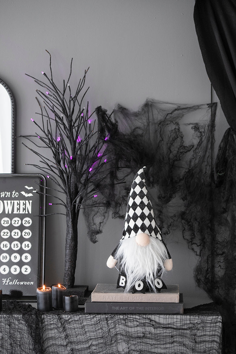 Black and white diamond pattern Halloween gnome with BOO on shirt