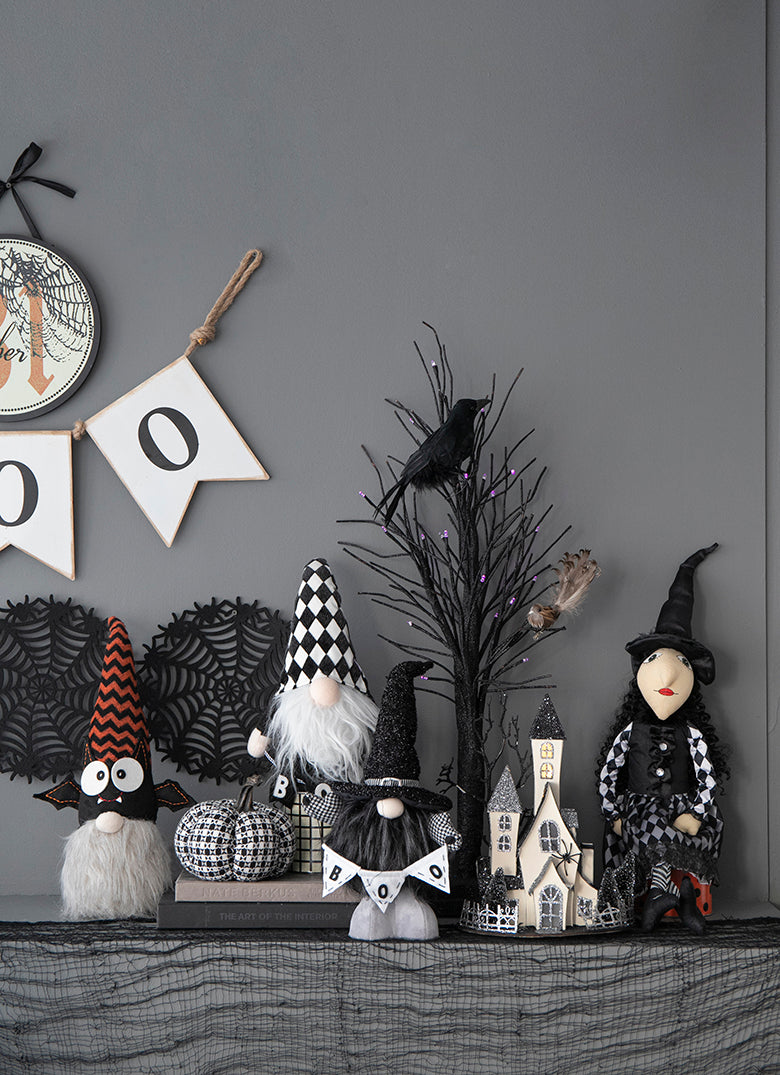 Spooky Halloween gnome with orange chevron hat and large googly eyes